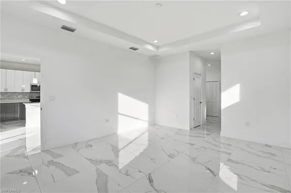 a bathroom with double vanity sinks and a mirror