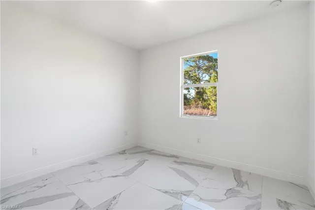 a bathroom with a sink toilet a mirror and shower
