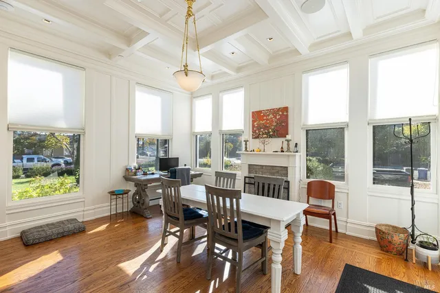 a view of a dining room with furniture window and wooden floor