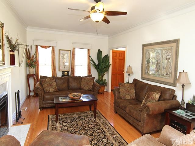 11800 Pembridge Lane Raleigh, NC 27613 - Photo 3 of 25 a living room with furniture and a fireplace