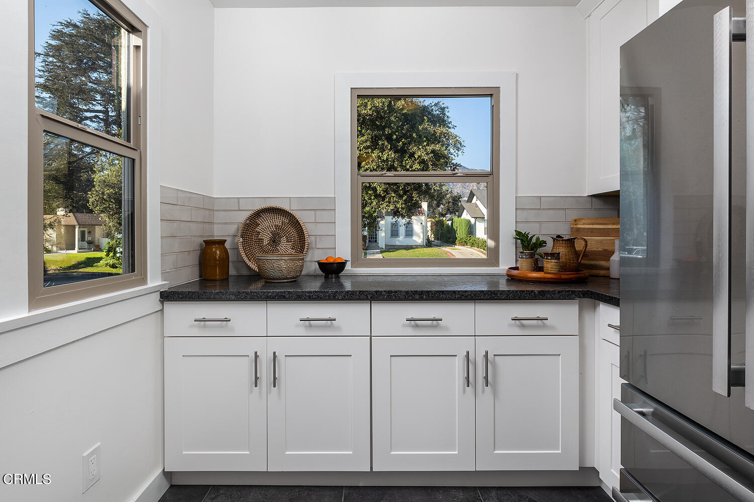 738 Burchett Street Glendale, CA 91202 - Photo 15 of 41 a kitchen with granite countertop white cabinets and window