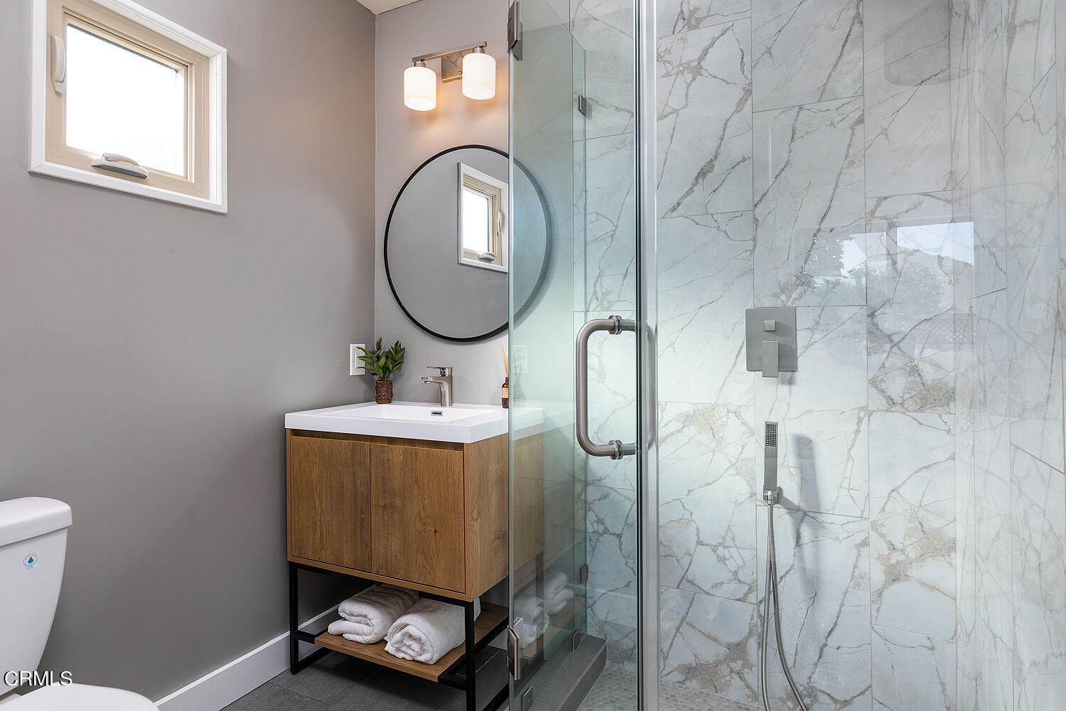 738 Burchett Street Glendale, CA 91202 - Photo 19 of 41 a bathroom with a sink mirror toilet and vanity