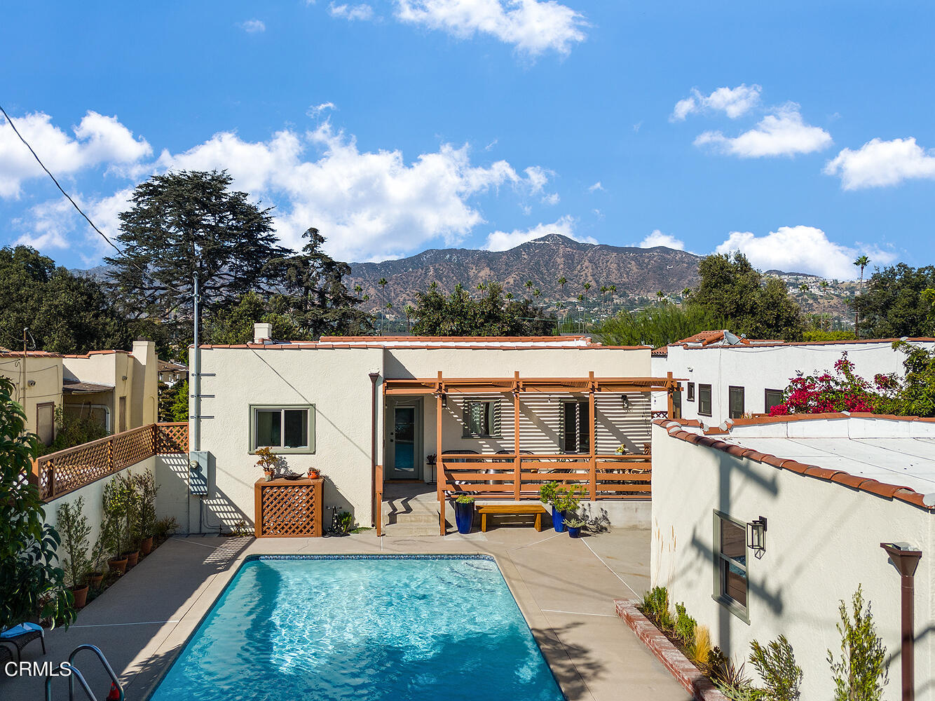 738 Burchett Street Glendale, CA 91202 - Photo 31 of 41 a view of a patio with dining table and chairs with a patio
