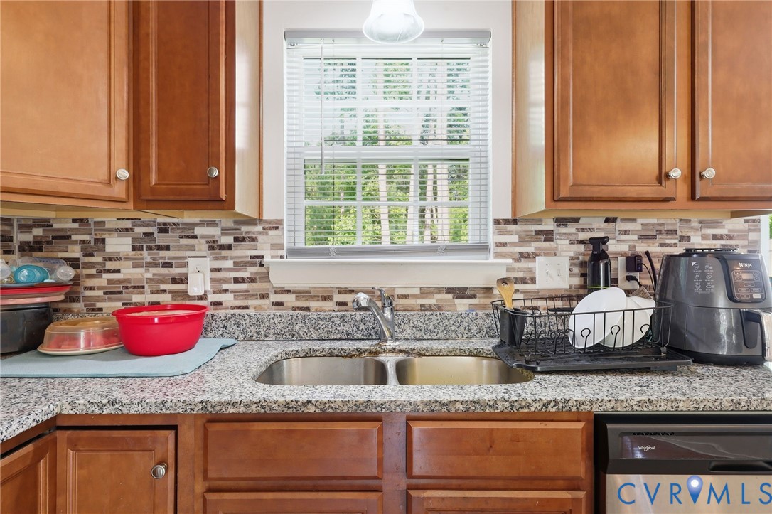 10155 Virginia Road Glen Allen, VA 23060 - Photo 32 of 50 Kitchen featuring wood cabinetry, a granite-look c