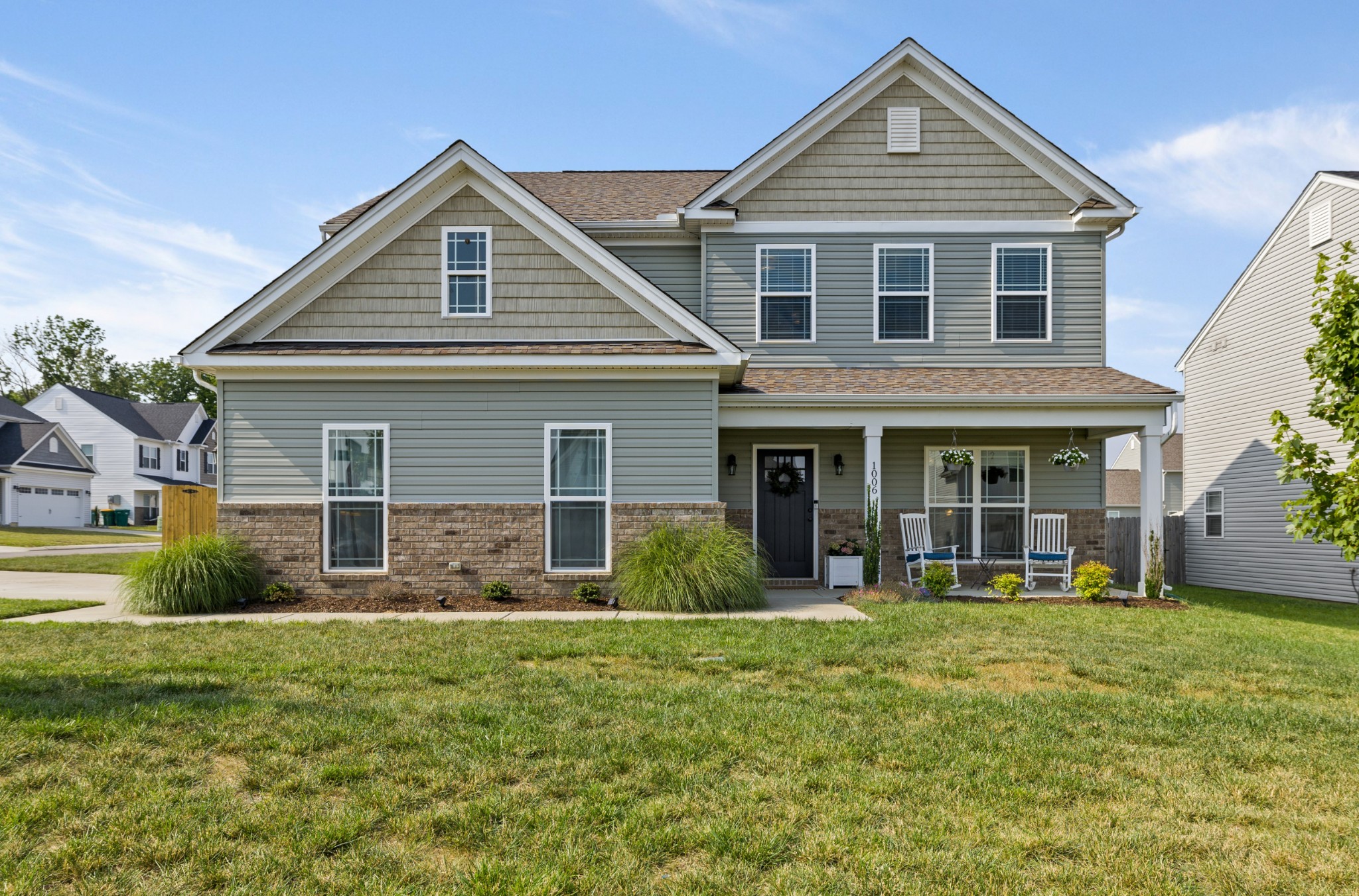 1006 Garrison Way Spring Hill, TN 37174 - Photo 1 of 46 a front view of a house with garden