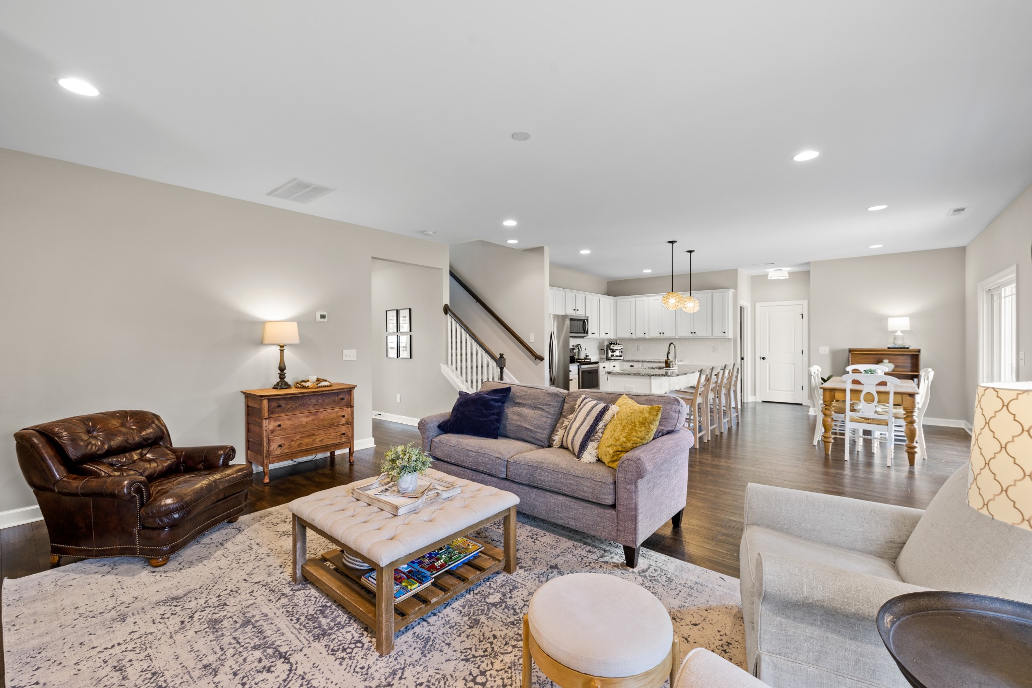 1006 Garrison Way Spring Hill, TN 37174 - Photo 13 of 46 a living room with furniture rug and kitchen view