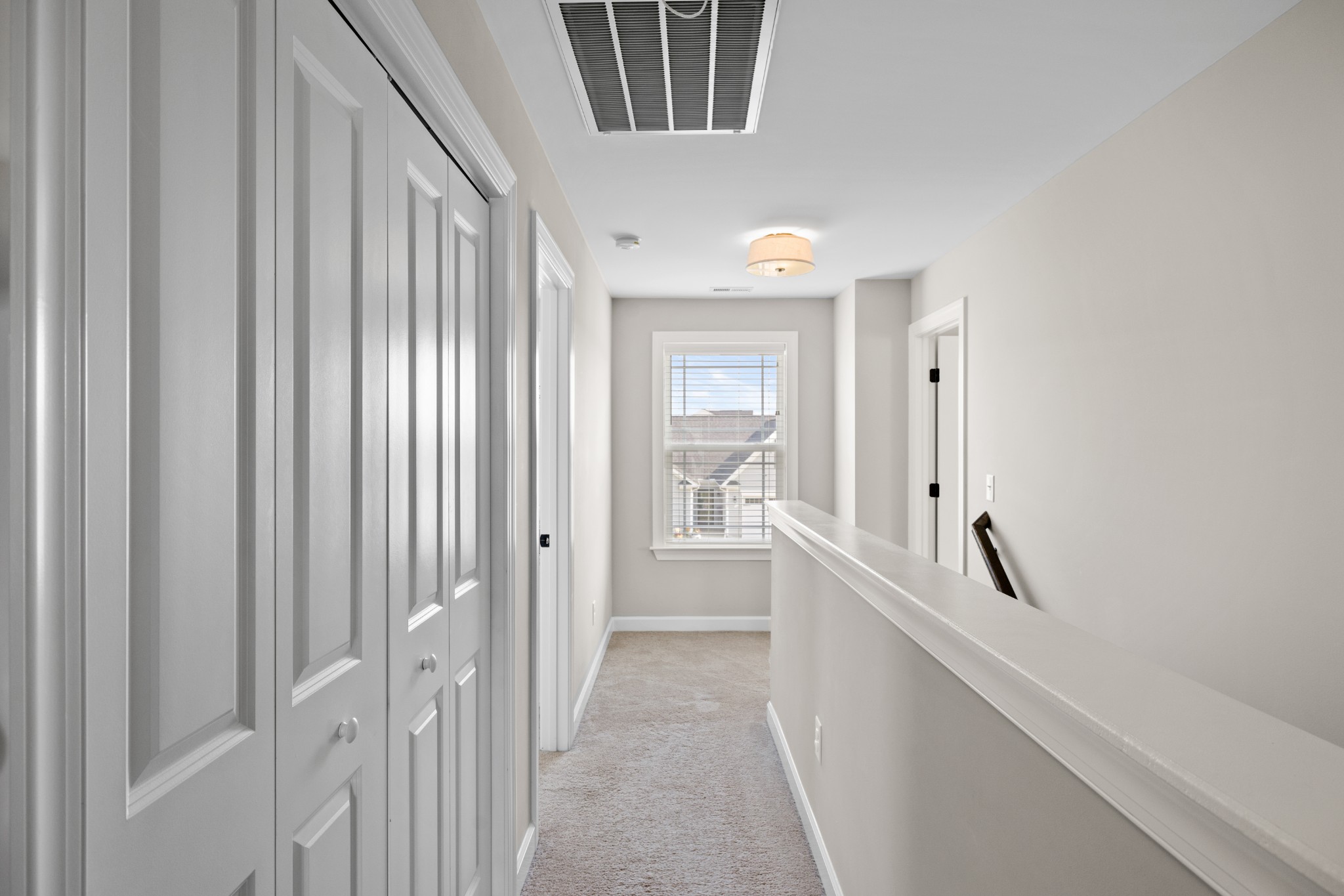 1006 Garrison Way Spring Hill, TN 37174 - Photo 24 of 46 a view of a hallway with a white walls and stairs