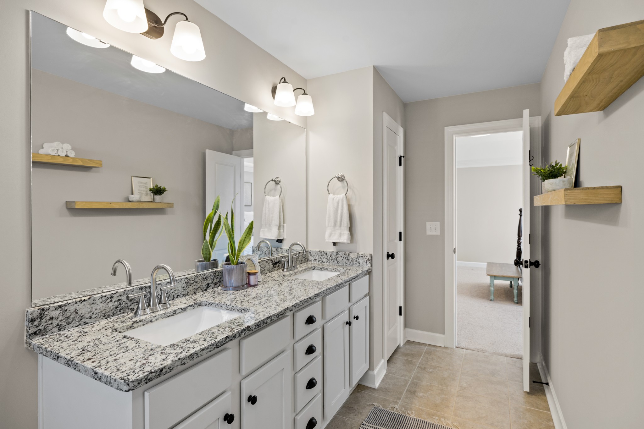 1006 Garrison Way Spring Hill, TN 37174 - Photo 29 of 46 a bathroom with a granite countertop double vanity sink and a mirror