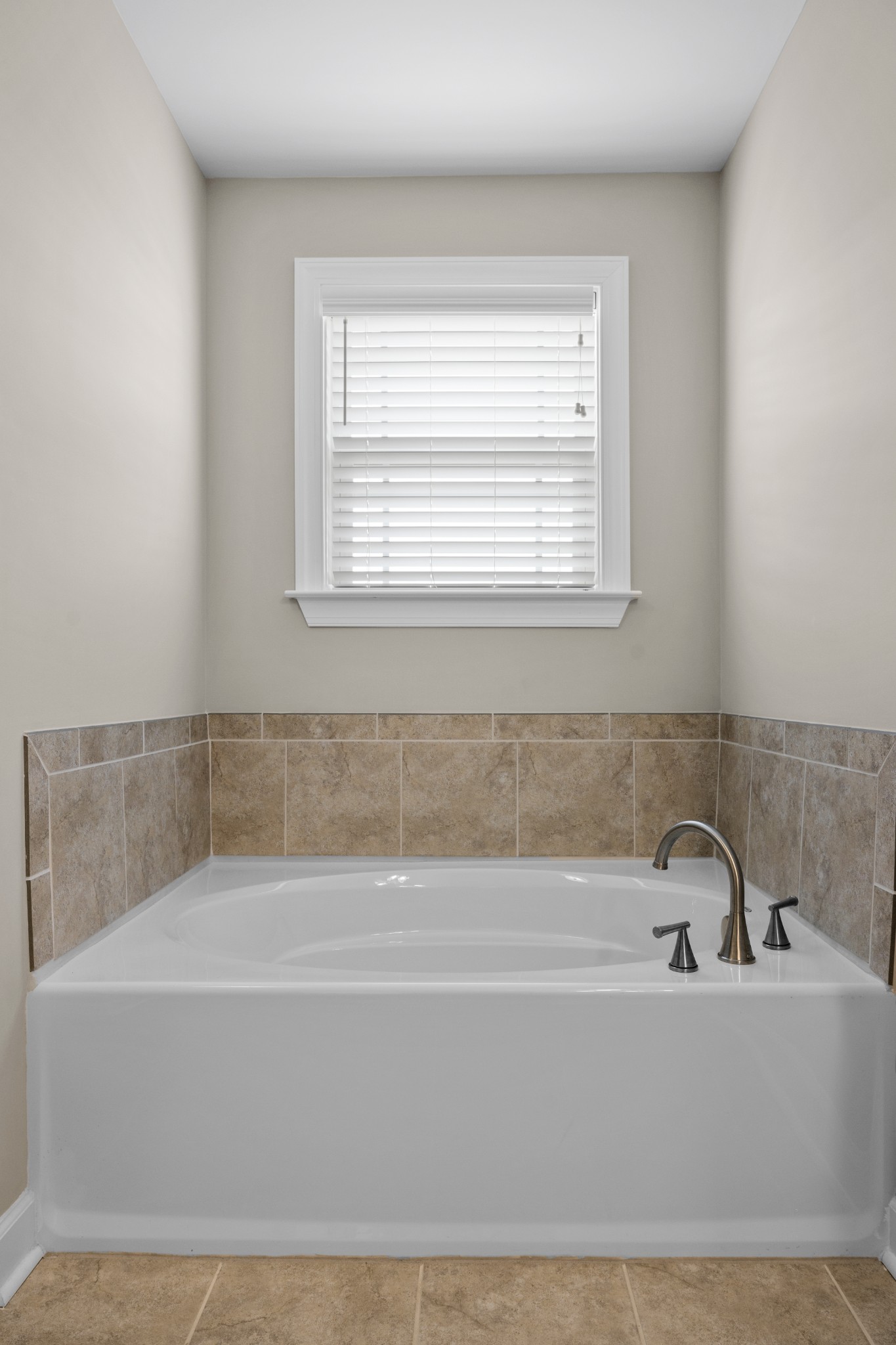 1006 Garrison Way Spring Hill, TN 37174 - Photo 30 of 46 a bathroom with a bathtub and a window