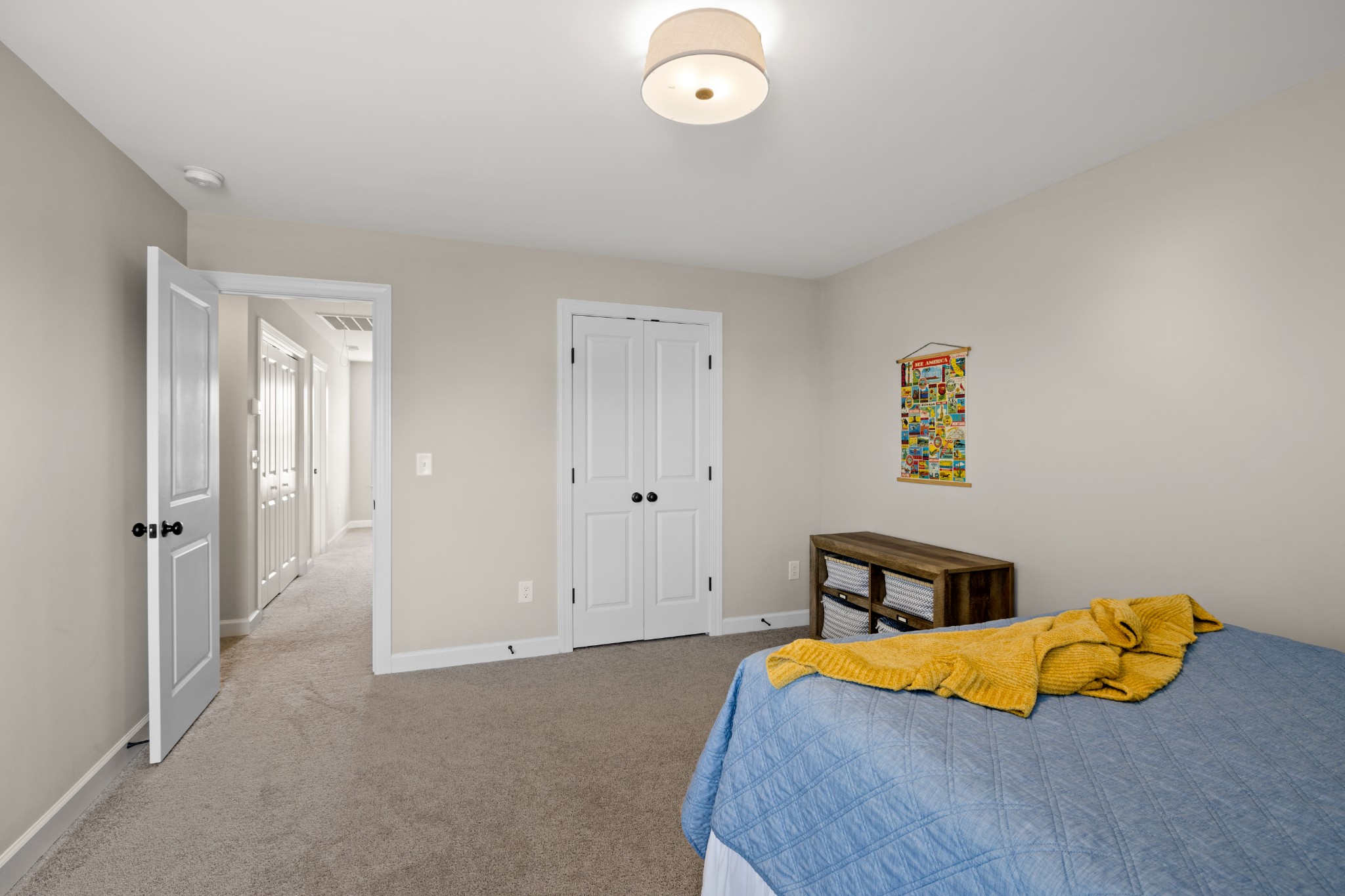 1006 Garrison Way Spring Hill, TN 37174 - Photo 39 of 46 a bedroom with a bed and blue walls