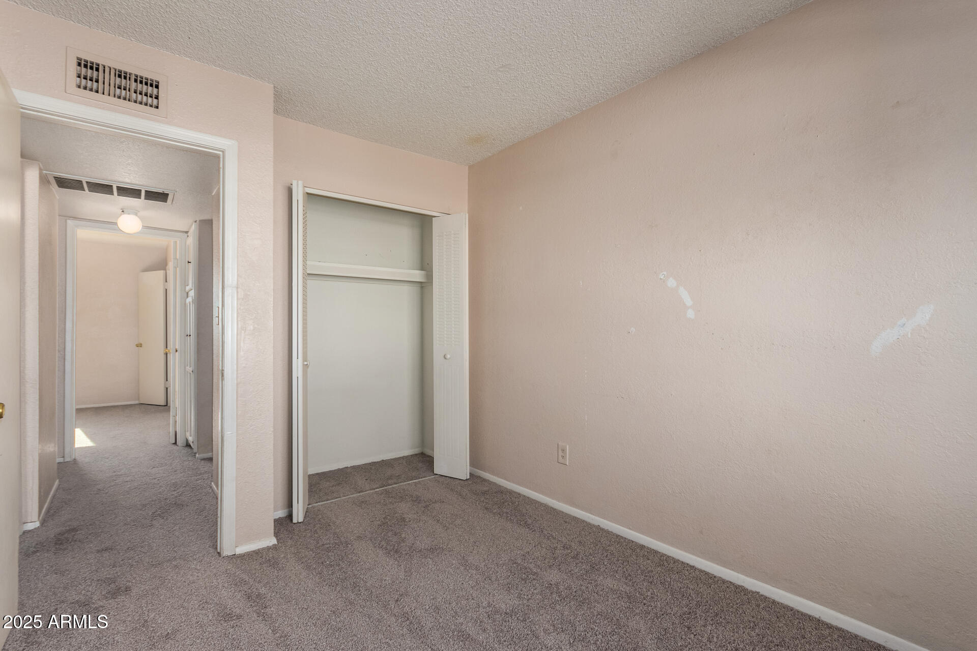 4625 West Thomas Road, Unit 43 Phoenix, AZ 85031 - Photo 14 of 26 an empty room with closet