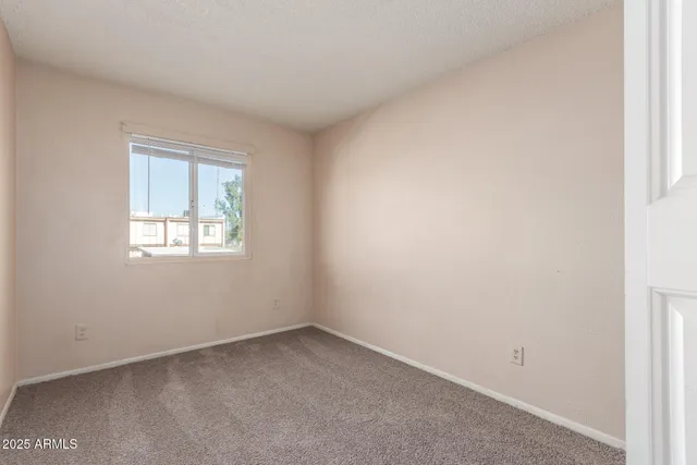 an empty room with closet and closet