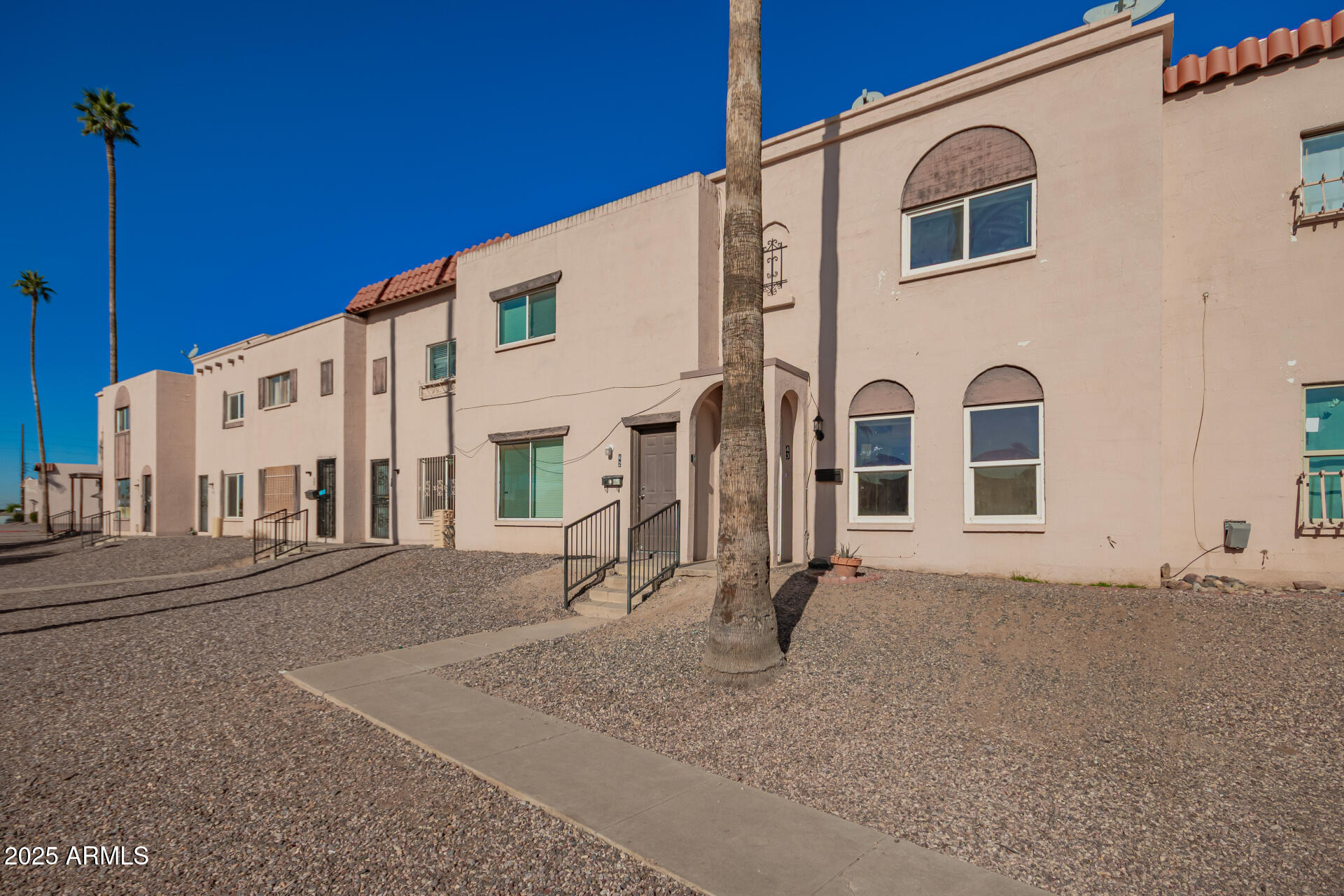 4625 West Thomas Road, Unit 43 Phoenix, AZ 85031 - Photo 2 of 26 a view of a building with a street