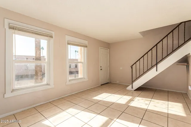 a view of an empty room with windows