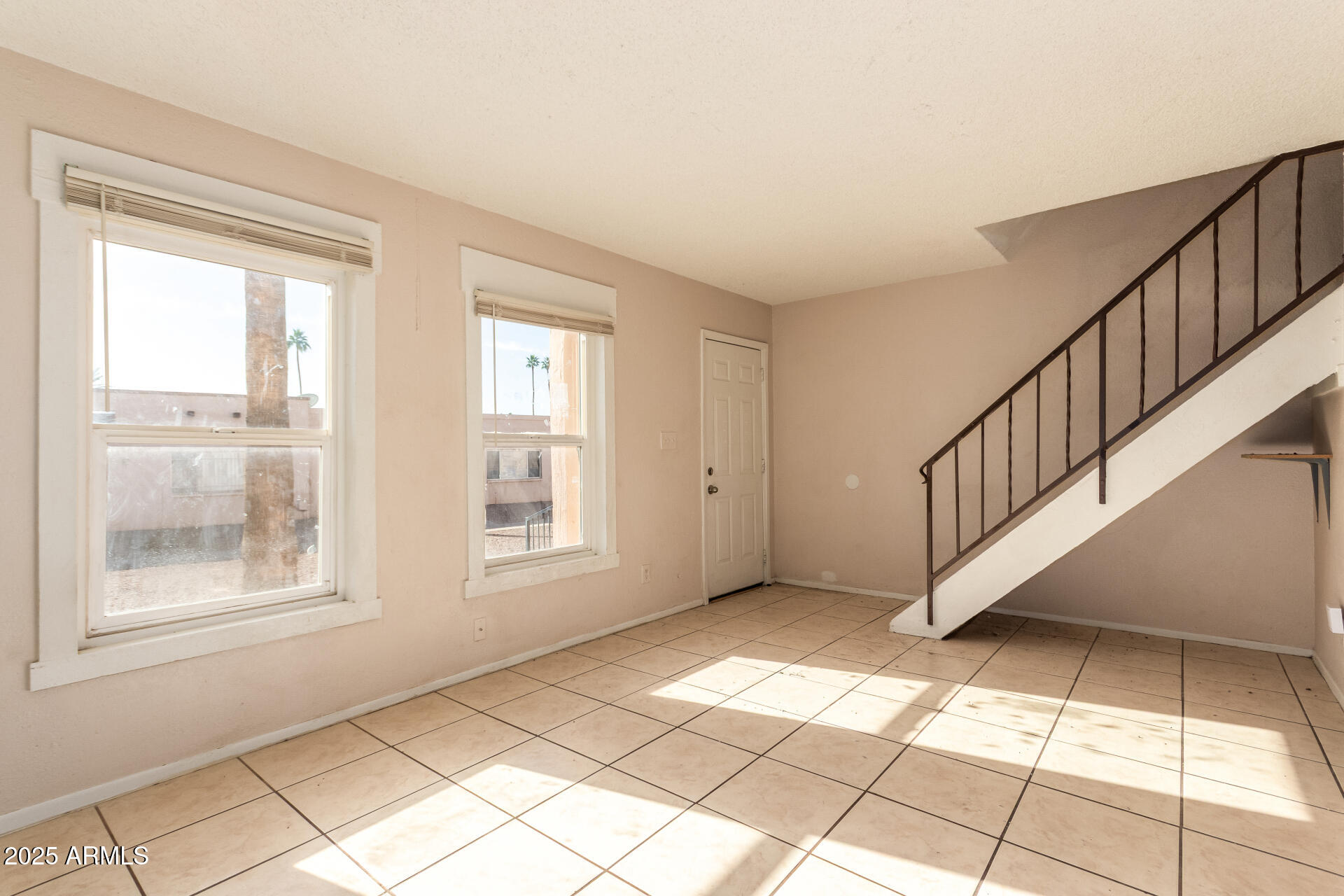 4625 West Thomas Road, Unit 43 Phoenix, AZ 85031 - Photo 5 of 26 a view of an empty room with windows