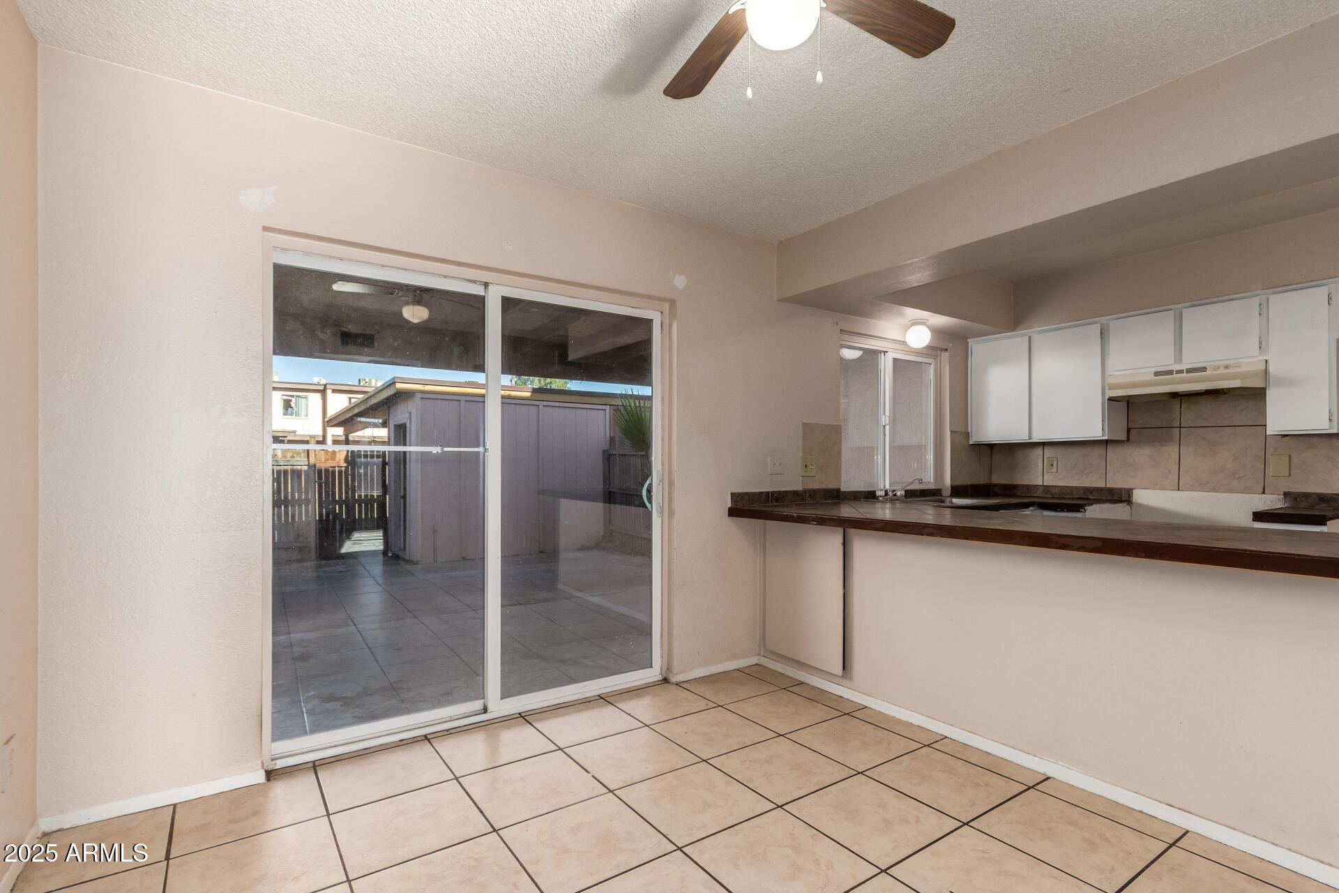 4625 West Thomas Road, Unit 43 Phoenix, AZ 85031 - Photo 7 of 26 a kitchen with stainless steel appliances granite countertop a sink and cabinets