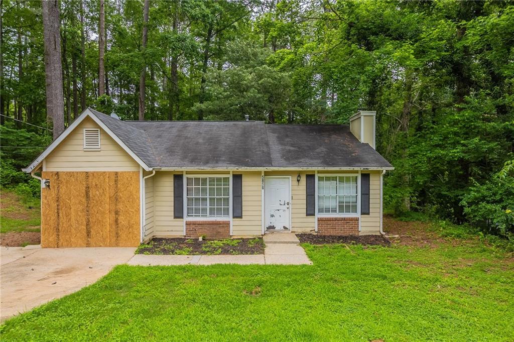 front view of a house with a yard