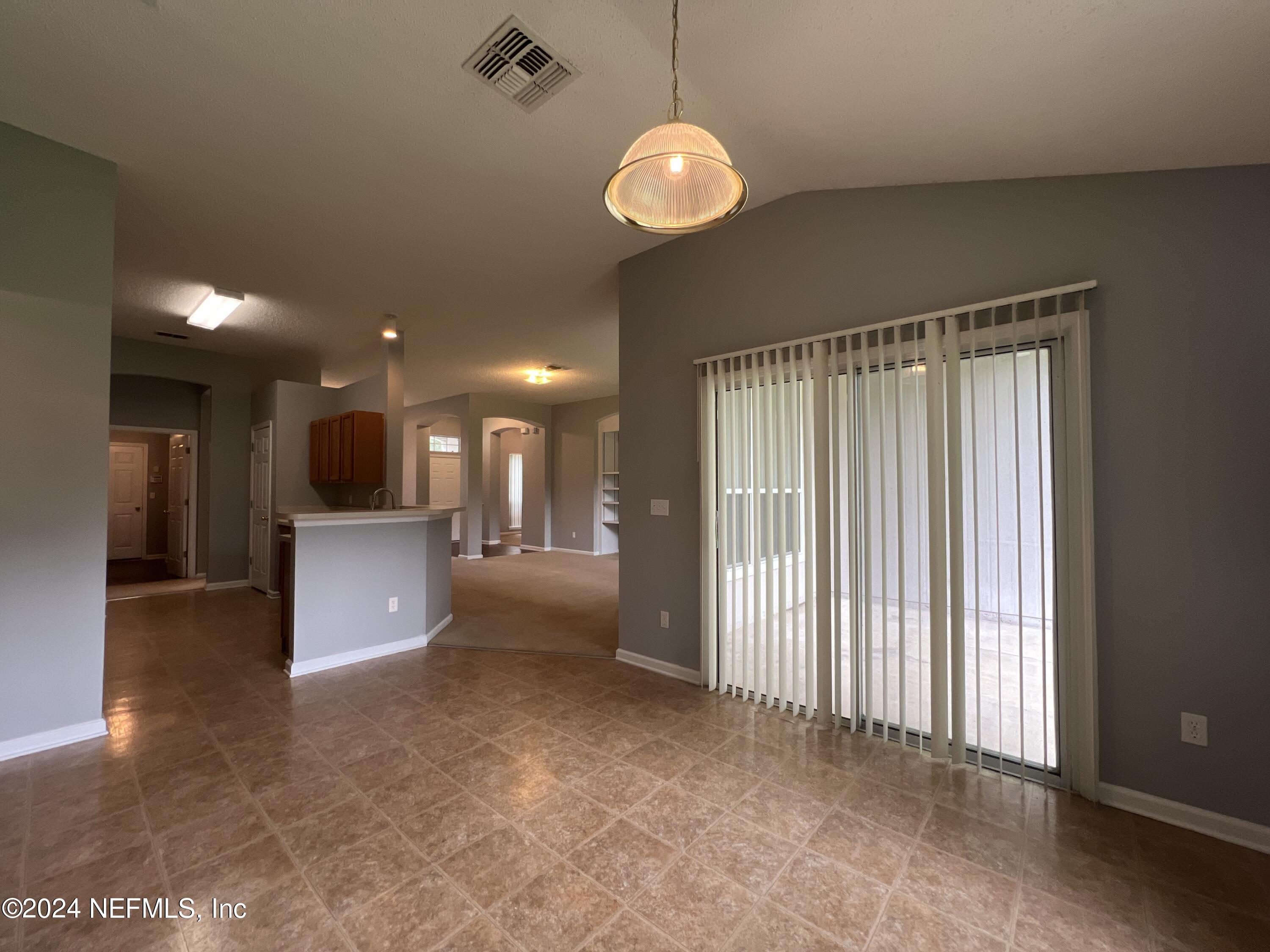 1402 Samantha Circle East Jacksonville, FL 32218 - Photo 13 of 33 a view of a big room with windows and chandelier