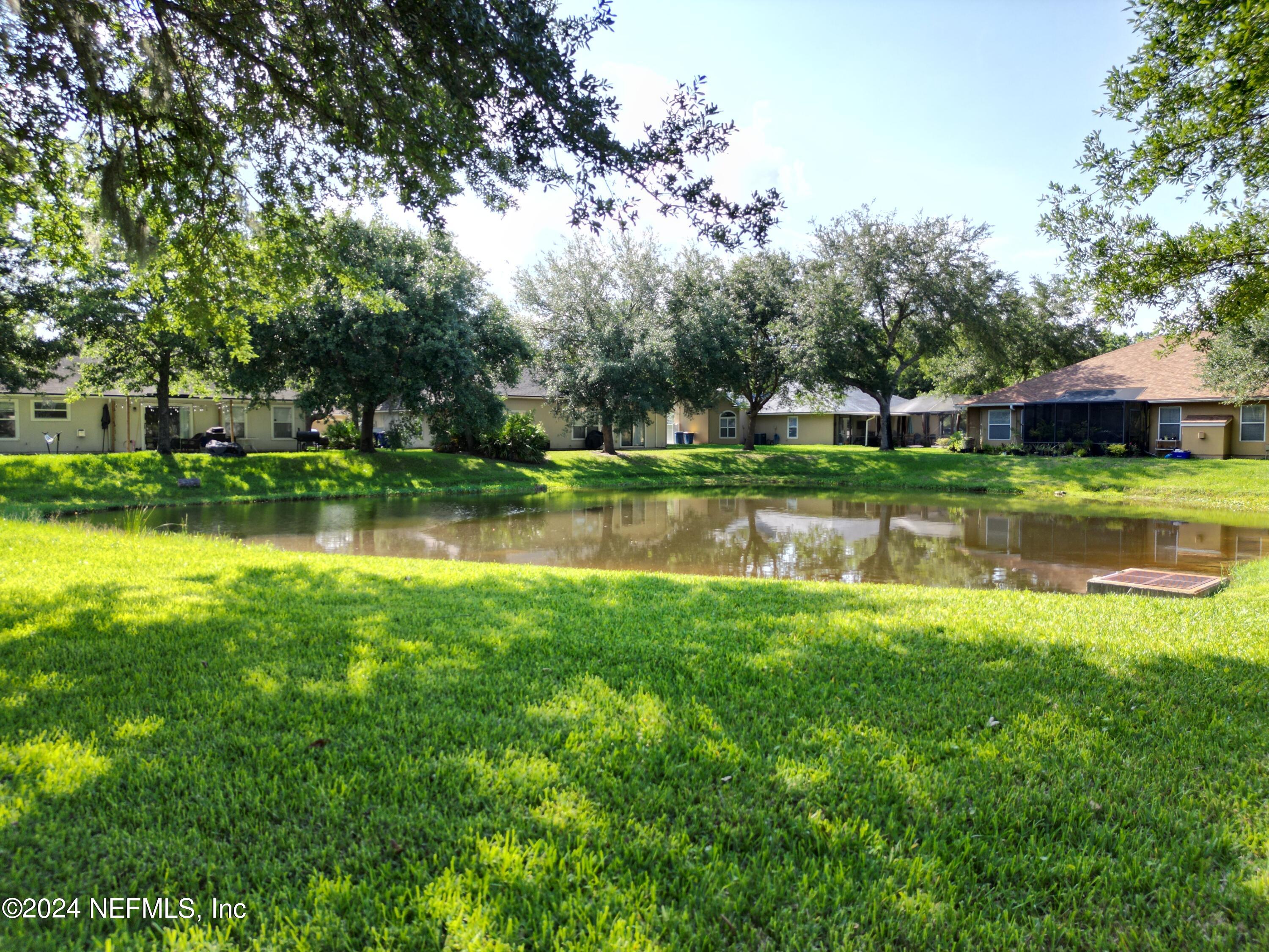 1402 Samantha Circle East Jacksonville, FL 32218 - Photo 32 of 33 a view of a park with large trees