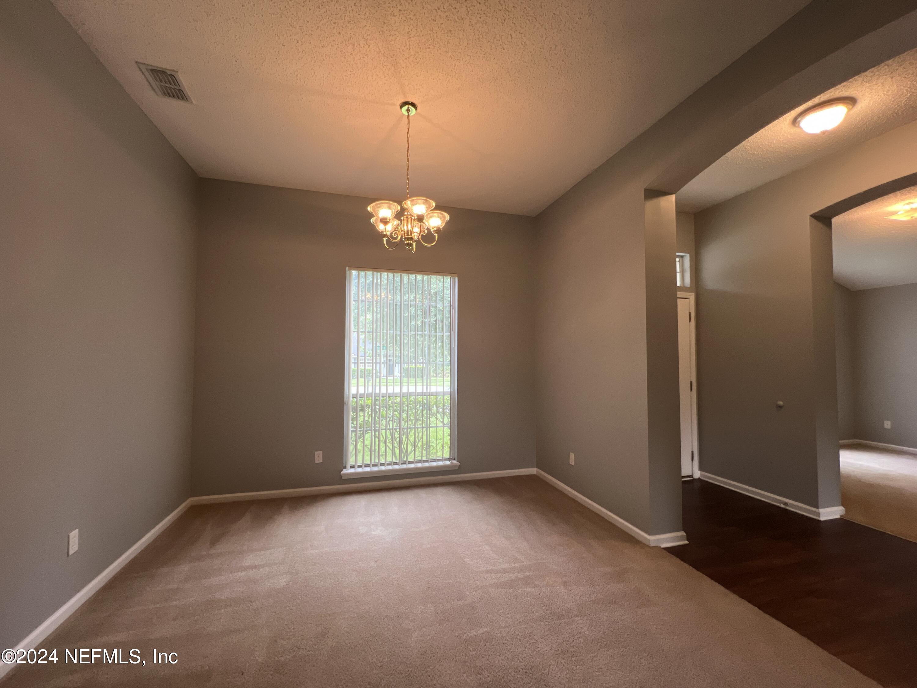1402 Samantha Circle East Jacksonville, FL 32218 - Photo 7 of 33 a view of an empty room with a window