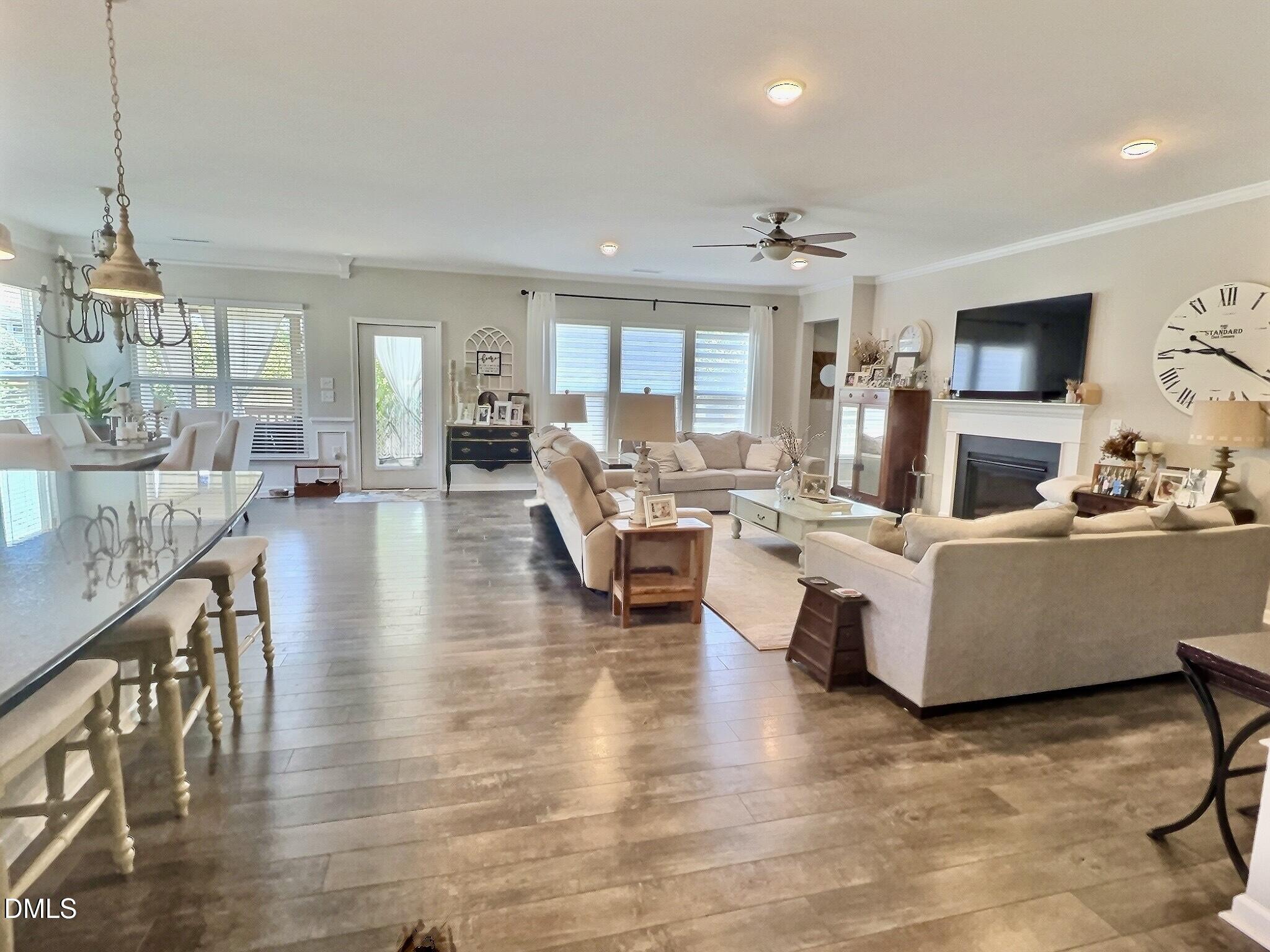 236 Oakmere Drive Cary, NC 27513 - Photo 13 of 49 a living room with fireplace furniture and a wooden floor
