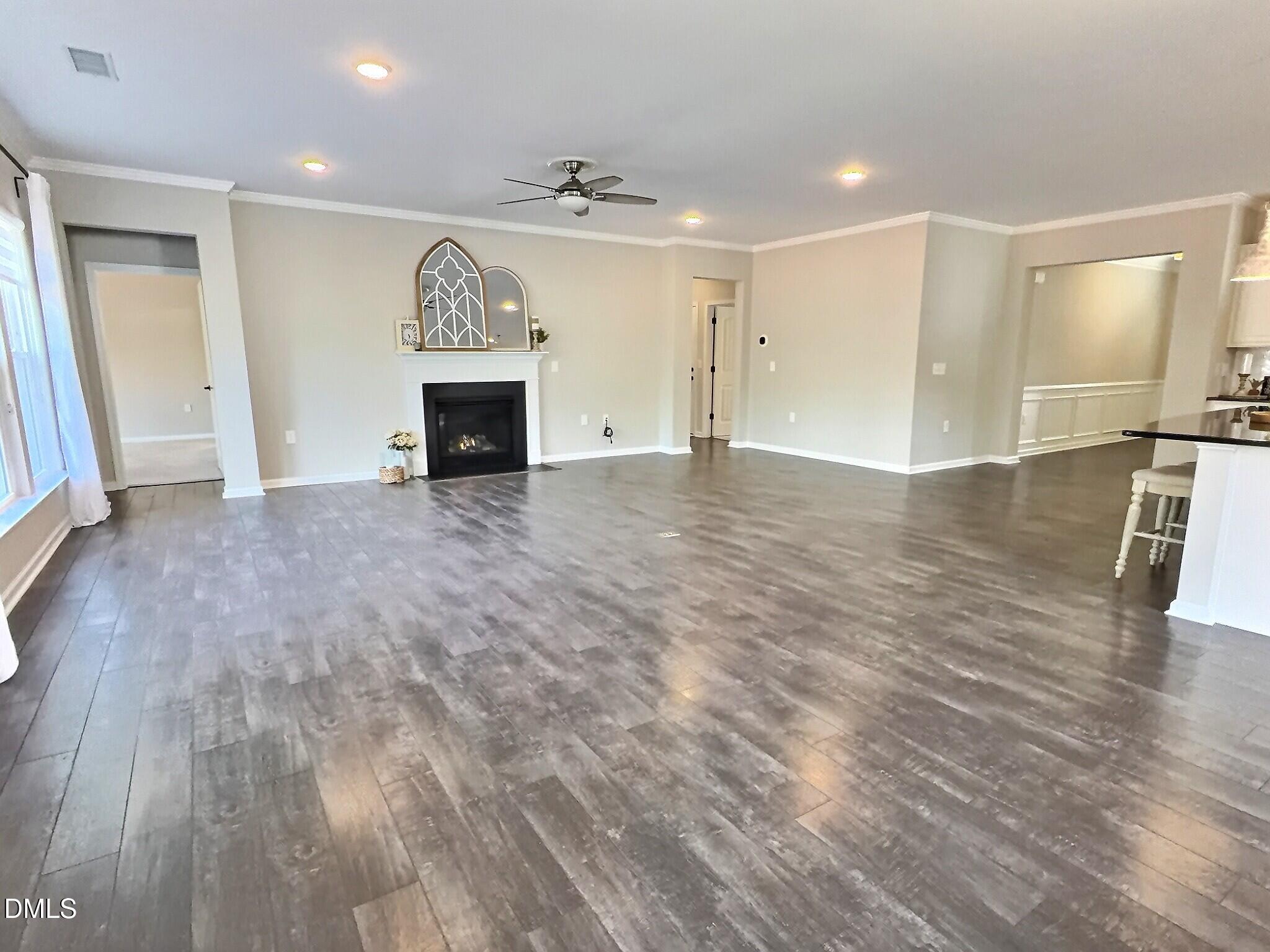 236 Oakmere Drive Cary, NC 27513 - Photo 15 of 49 an empty room with wooden floor and fireplace