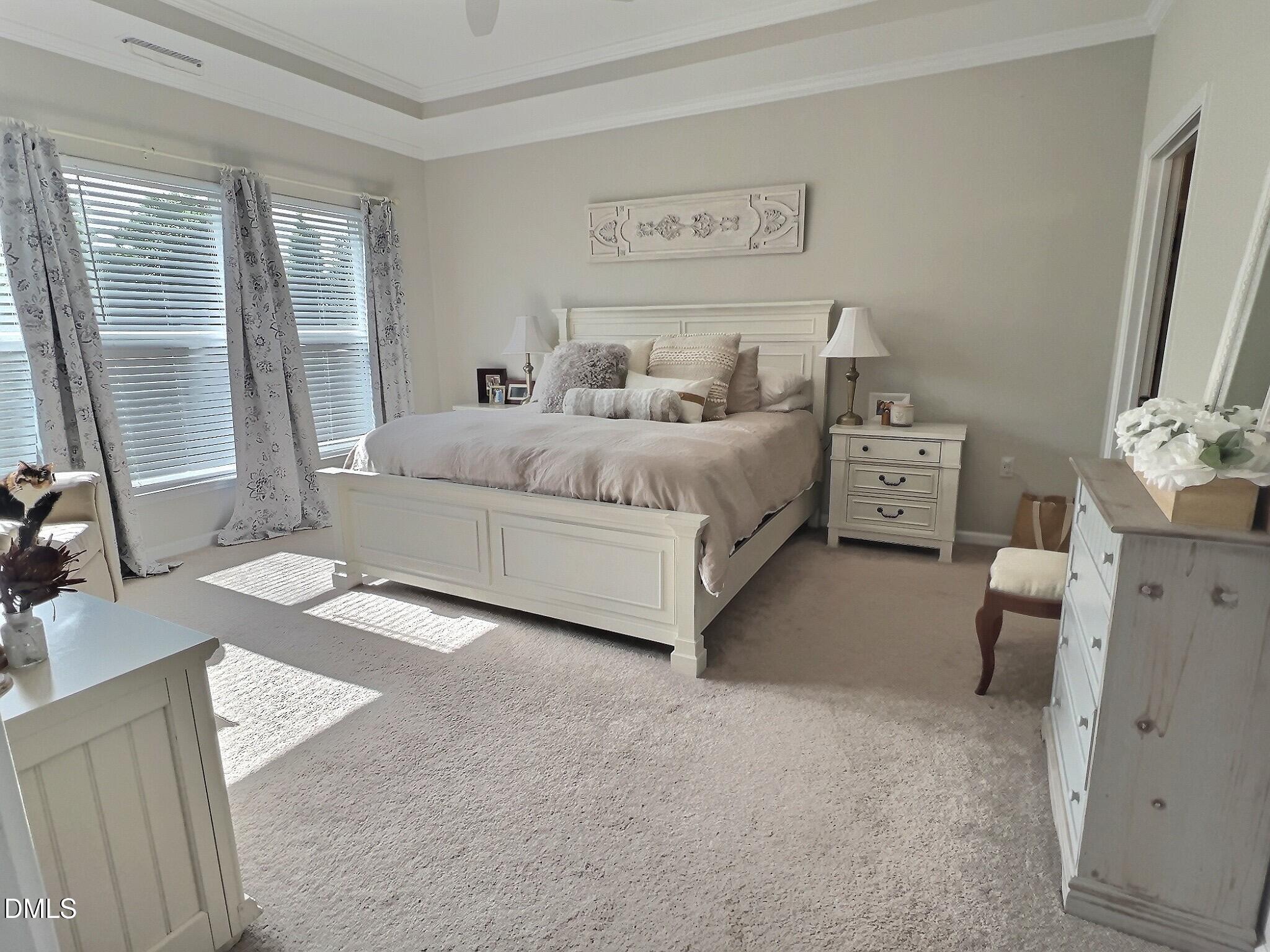 236 Oakmere Drive Cary, NC 27513 - Photo 18 of 49 a bedroom with a bed and a flat tv screen