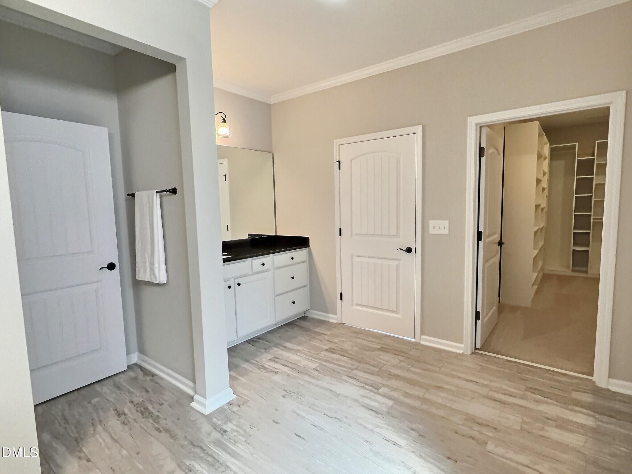 236 Oakmere Drive Cary, NC 27513 - Photo 23 of 49 wooden floor with white cabinet and cabinet area