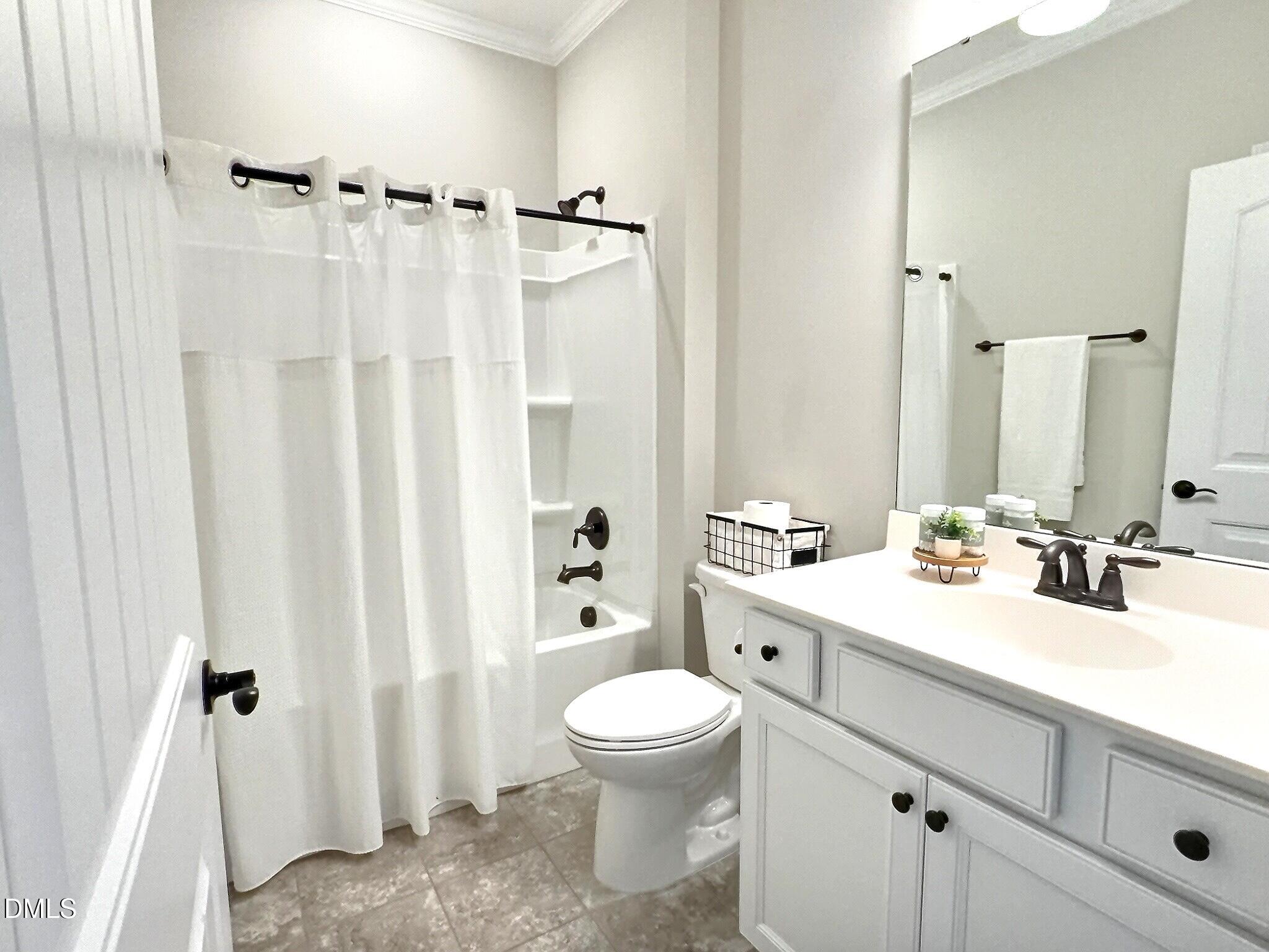 236 Oakmere Drive Cary, NC 27513 - Photo 27 of 49 a bathroom with a double vanity sink toilet and shower