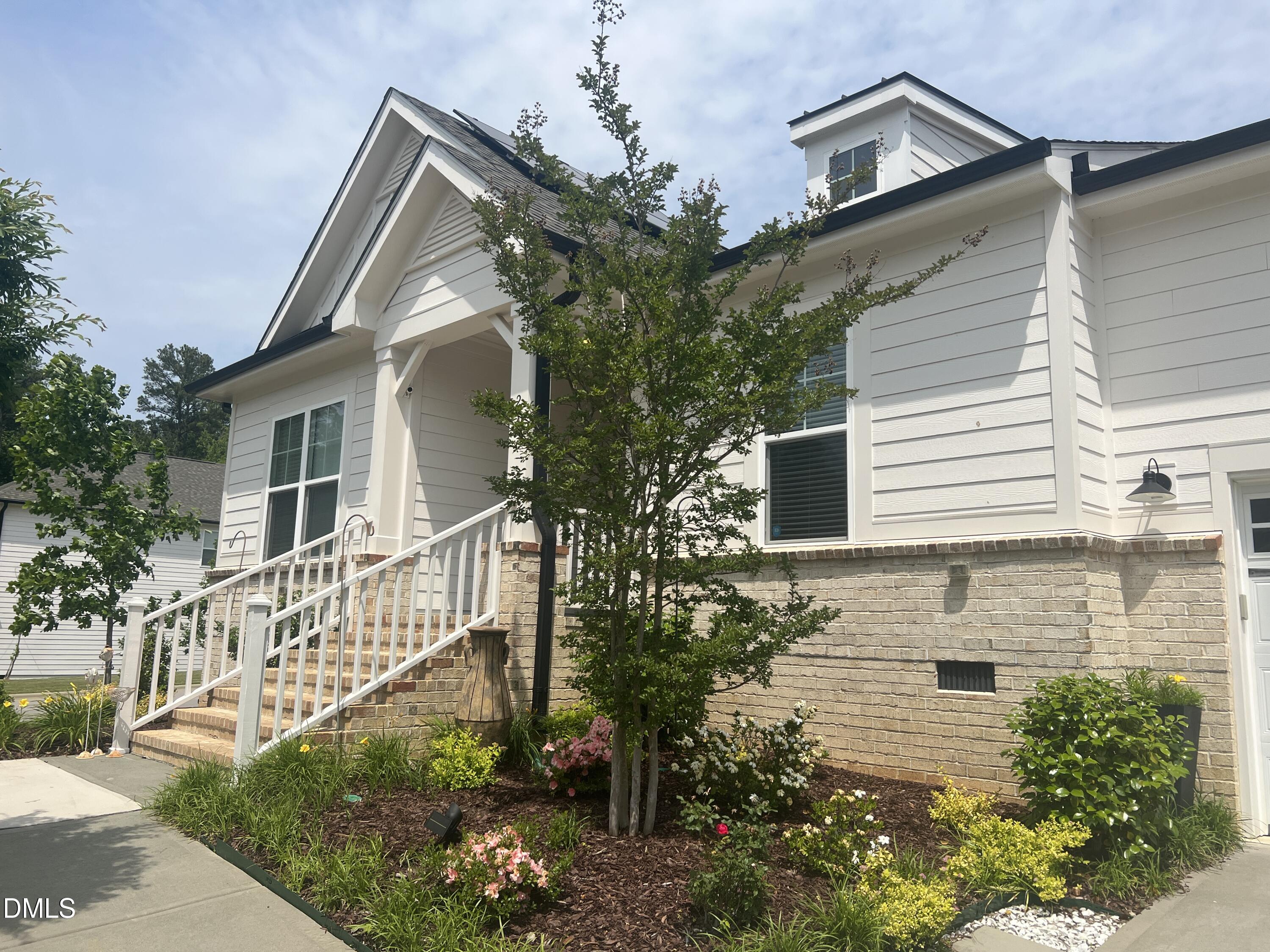 236 Oakmere Drive Cary, NC 27513 - Photo 2 of 49 a front view of a house with garden