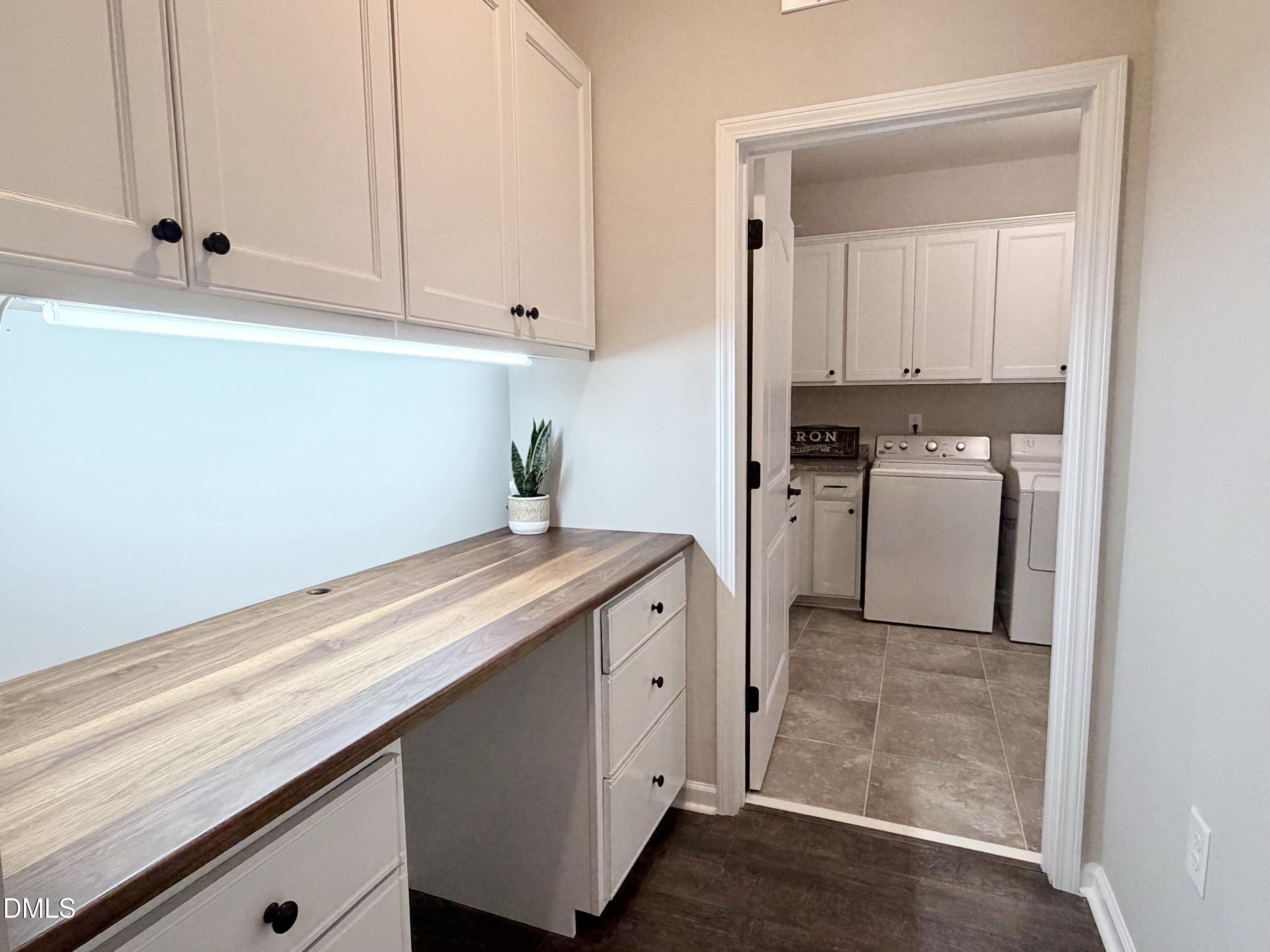 236 Oakmere Drive Cary, NC 27513 - Photo 32 of 49 a kitchen with granite countertop cabinets stainless steel appliances and a counter space