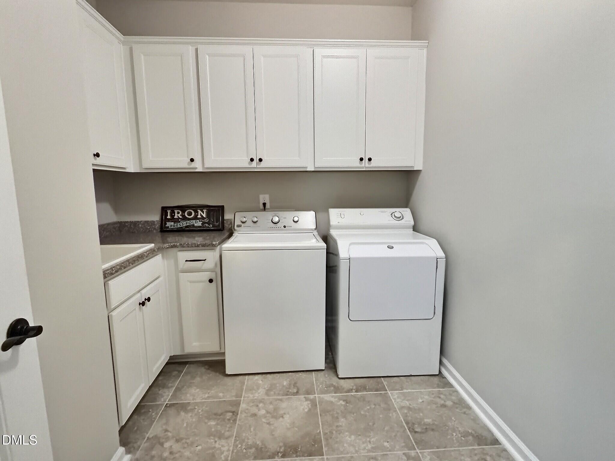 236 Oakmere Drive Cary, NC 27513 - Photo 33 of 49 a utility room with dryer and washer