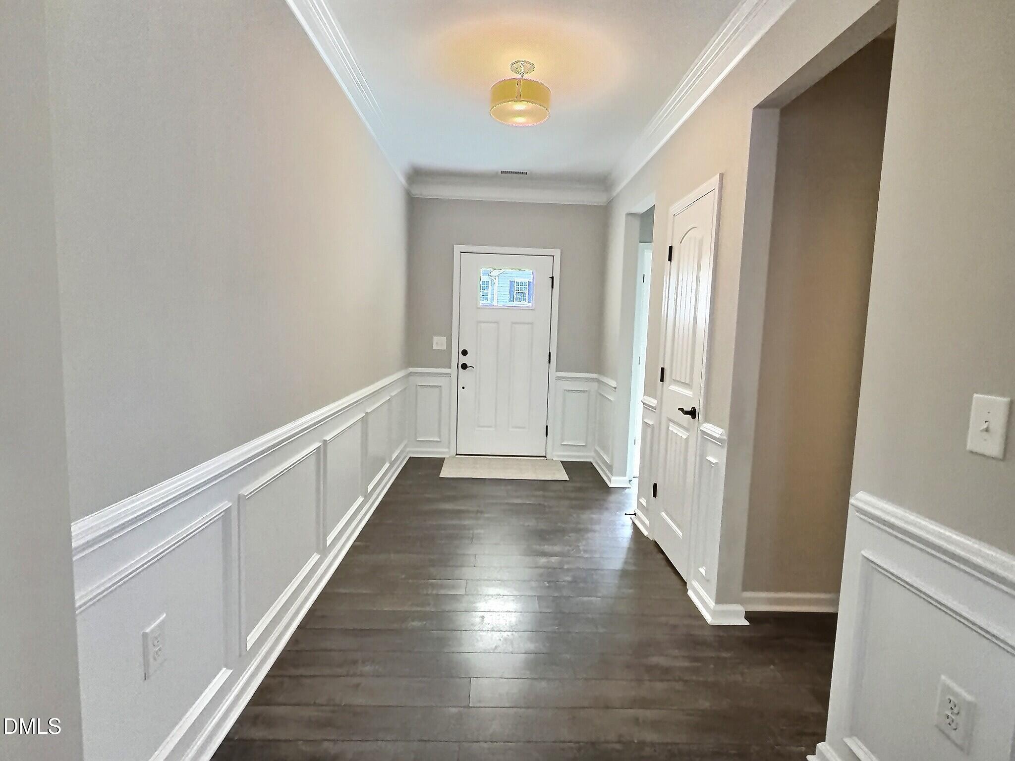 236 Oakmere Drive Cary, NC 27513 - Photo 6 of 49 a view of a hallway with wooden floor