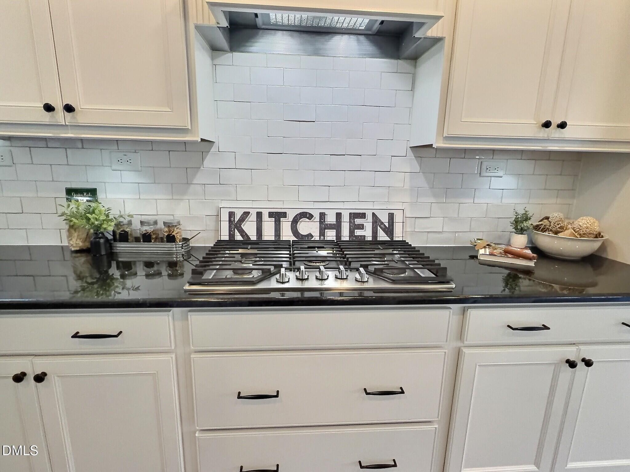 236 Oakmere Drive Cary, NC 27513 - Photo 9 of 49 a kitchen with granite countertop white cabinets and white appliances