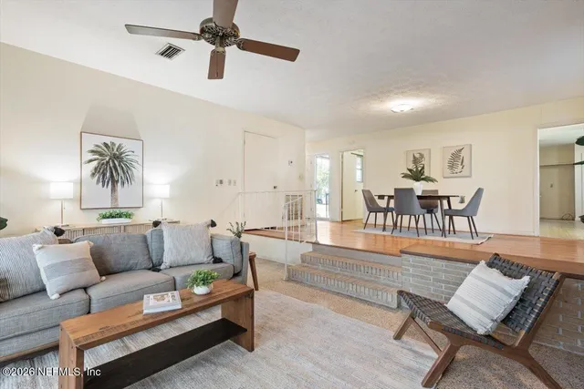 a bathroom with a tub a rug and a shower