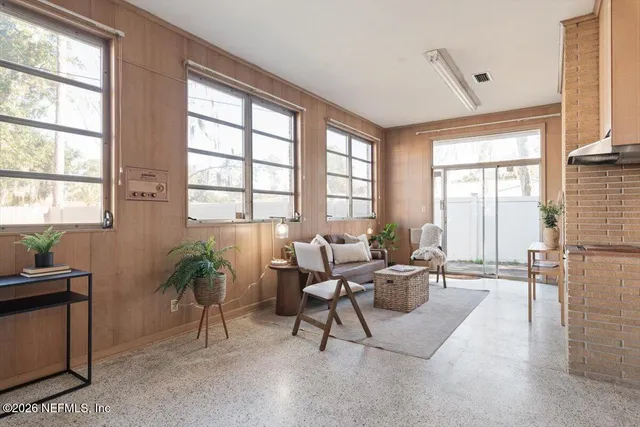 a living room with furniture and a window