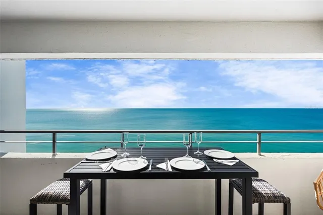 a view of a balcony with furniture