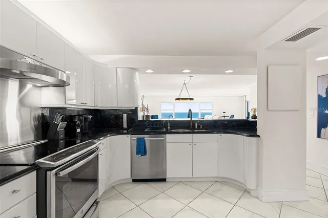 a kitchen with a sink and a stove