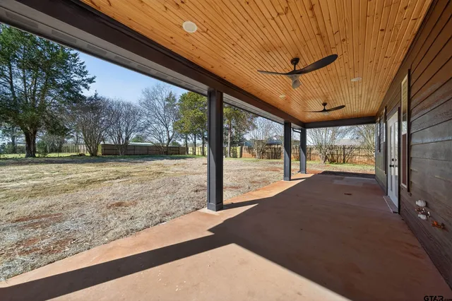 a spacious bathroom with a double vanity sink and mirror