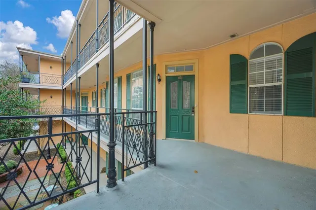 a view of a building with sitting area