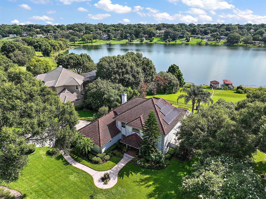 2701 Regal Point Place Eustis, FL 32726 - Photo 12 of 53 an aerial view of a house with outdoor space and lake view
