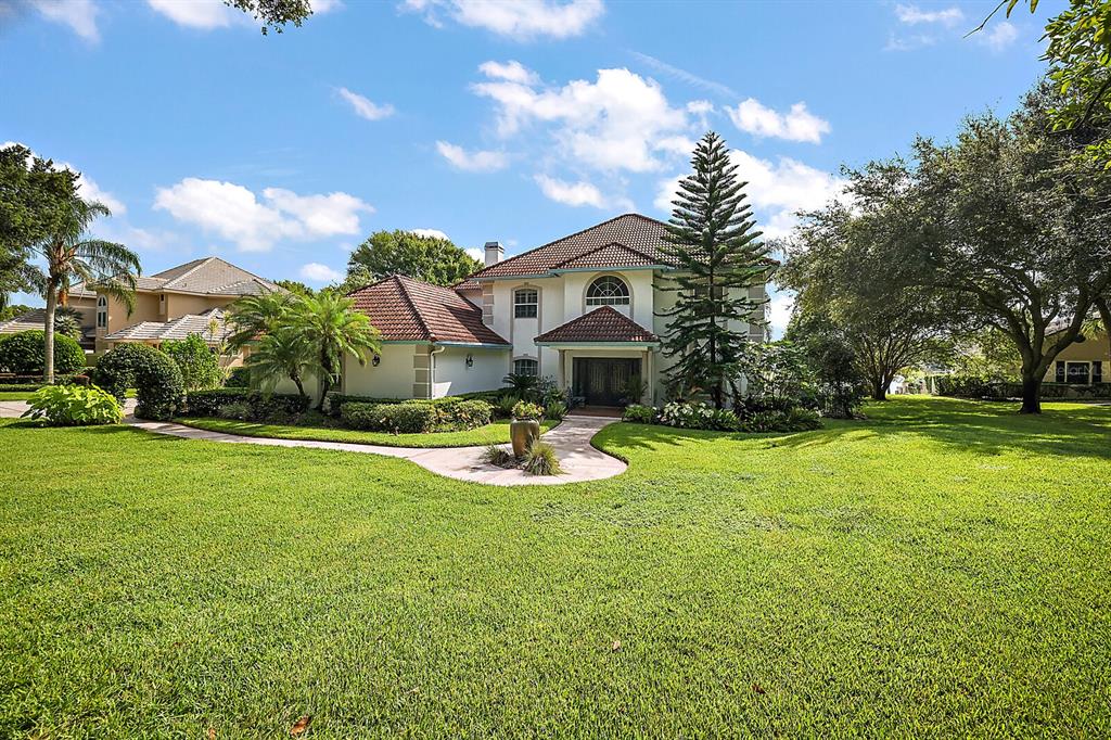 2701 Regal Point Place Eustis, FL 32726 - Photo 14 of 53 a view of a house with swimming pool and a yard