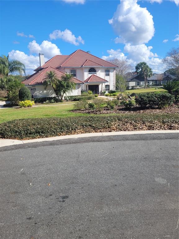 2701 Regal Point Place Eustis, FL 32726 - Photo 2 of 53 a view of a house with a yard