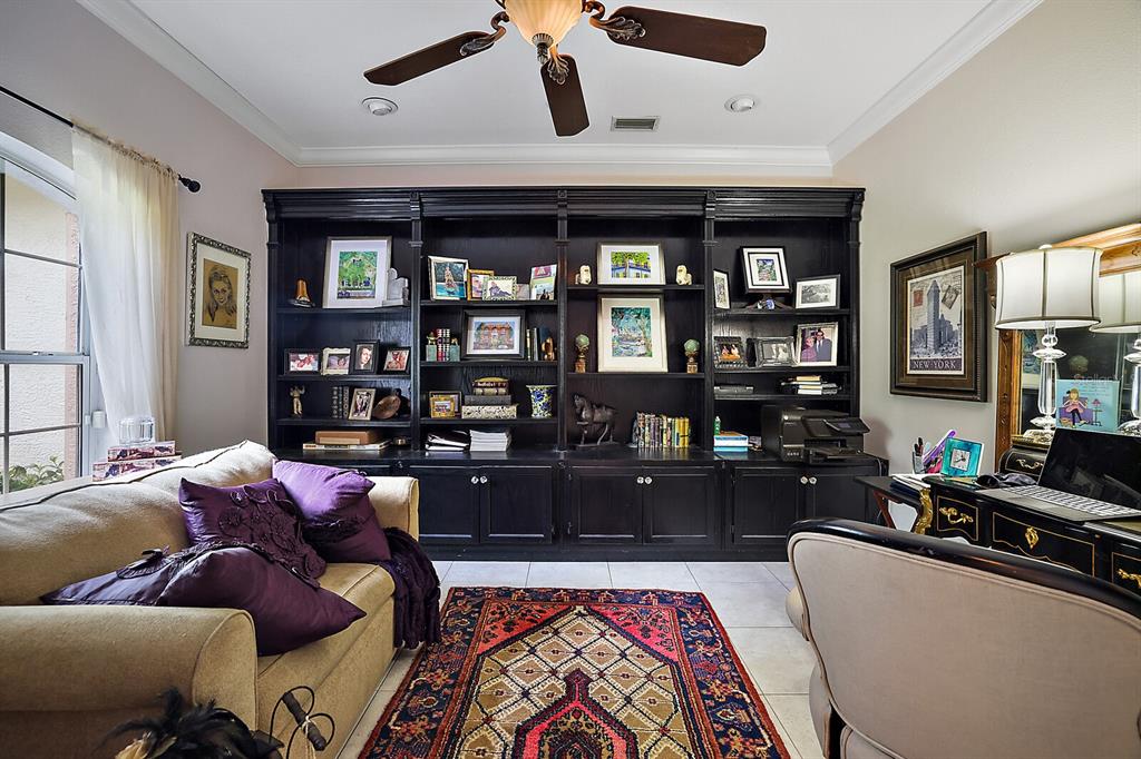 2701 Regal Point Place Eustis, FL 32726 - Photo 21 of 53 a living room with furniture and a book shelf