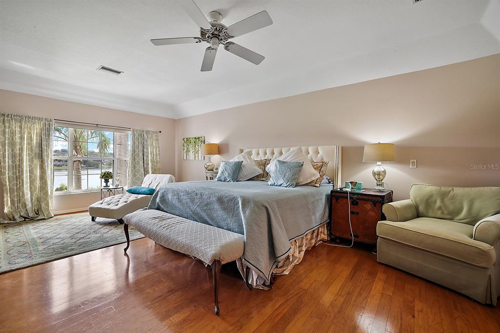 2701 Regal Point Place Eustis, FL 32726 - Photo 25 of 53 a bedroom with furniture and wooden floor