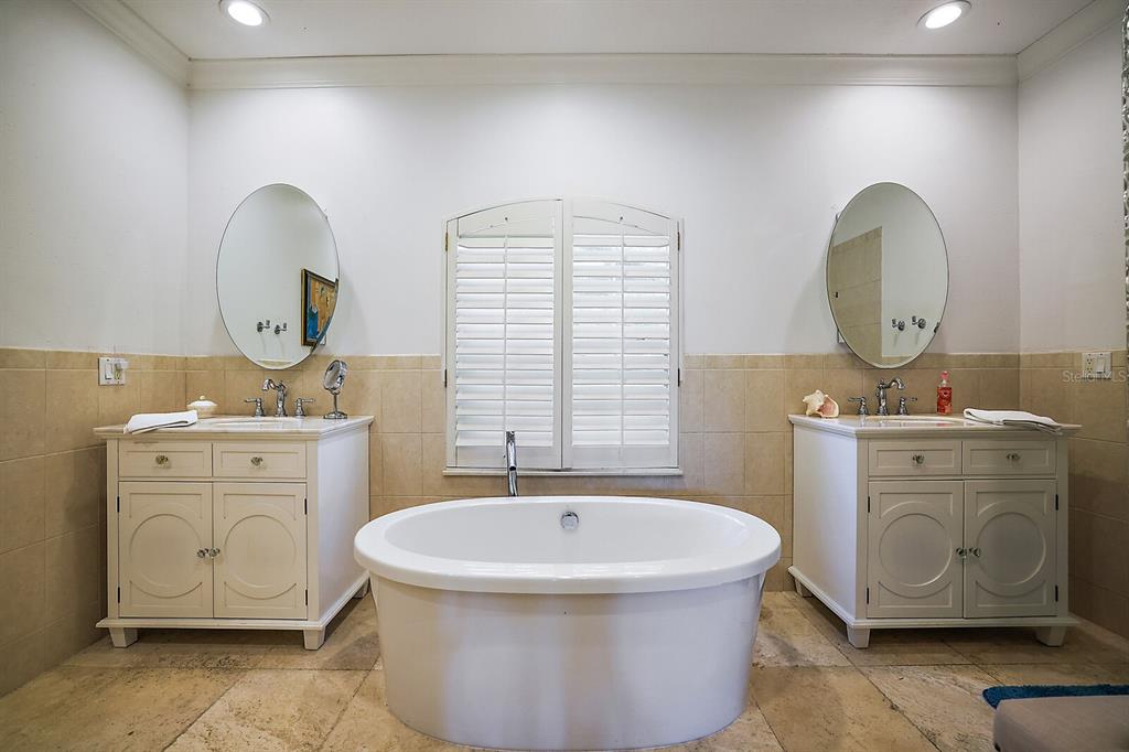 2701 Regal Point Place Eustis, FL 32726 - Photo 27 of 53 a bathroom with a toilet sink and mirror