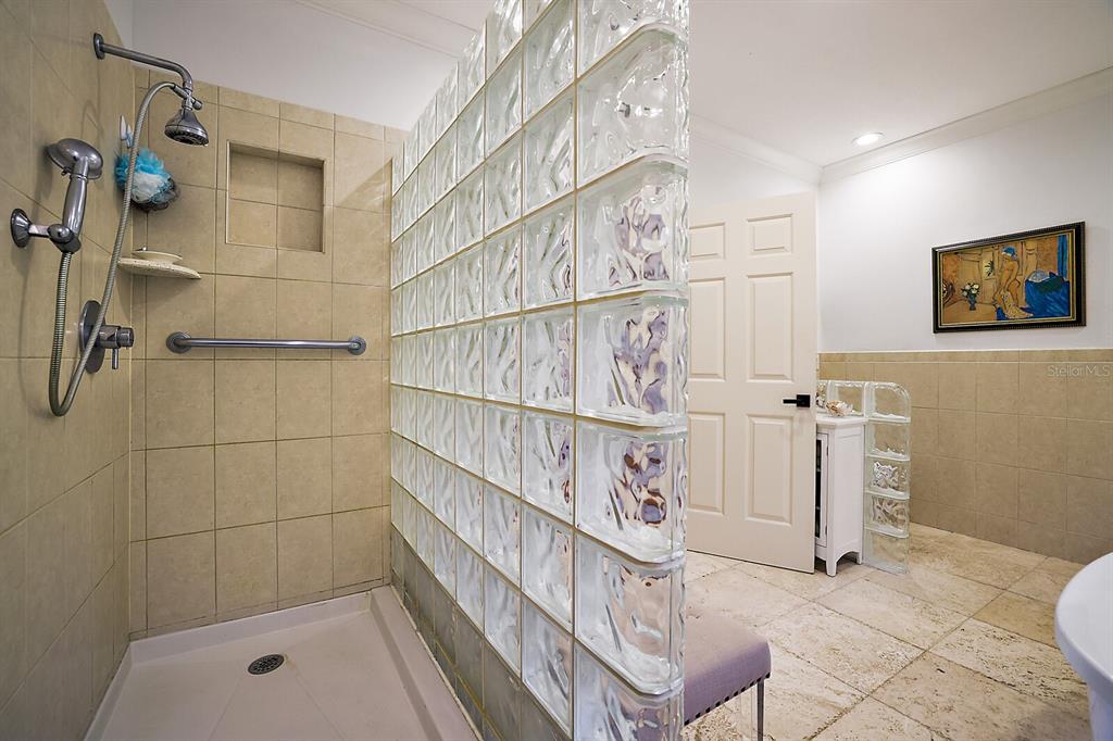 2701 Regal Point Place Eustis, FL 32726 - Photo 29 of 53 a bathroom with a bathtub and shower