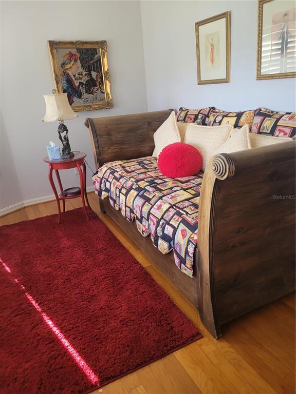 2701 Regal Point Place Eustis, FL 32726 - Photo 30 of 53 a bedroom with a bed and painting on the wall