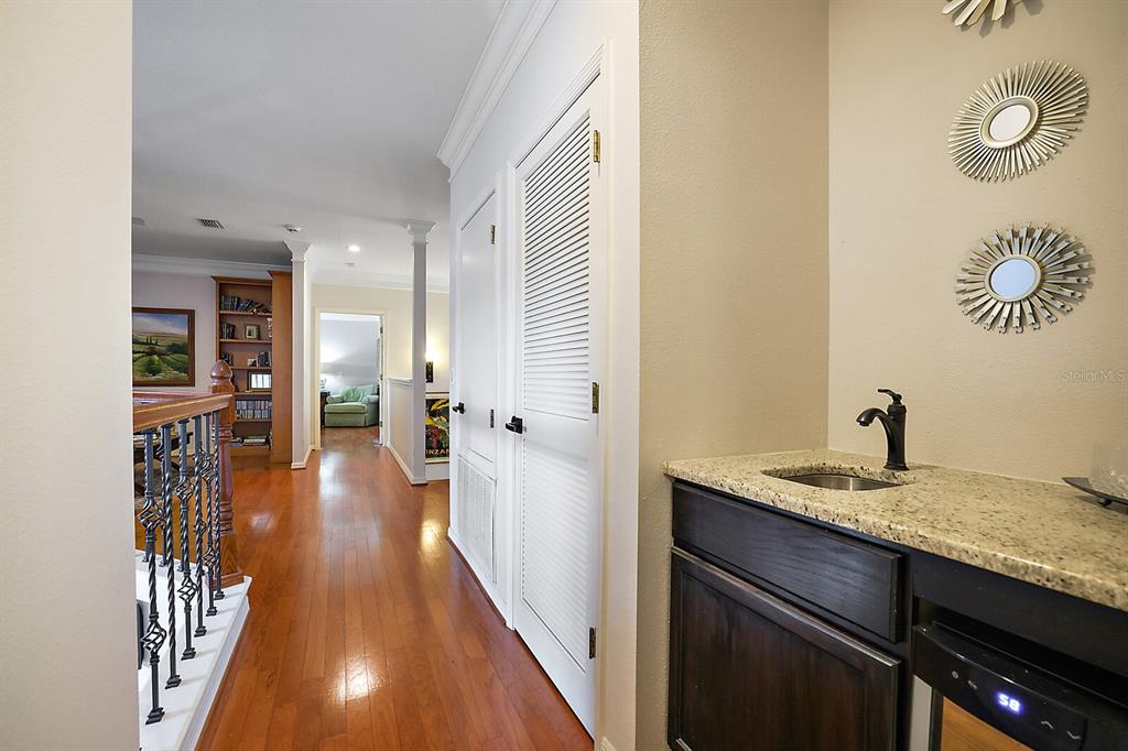 2701 Regal Point Place Eustis, FL 32726 - Photo 33 of 53 a view of a hallway with wooden floor