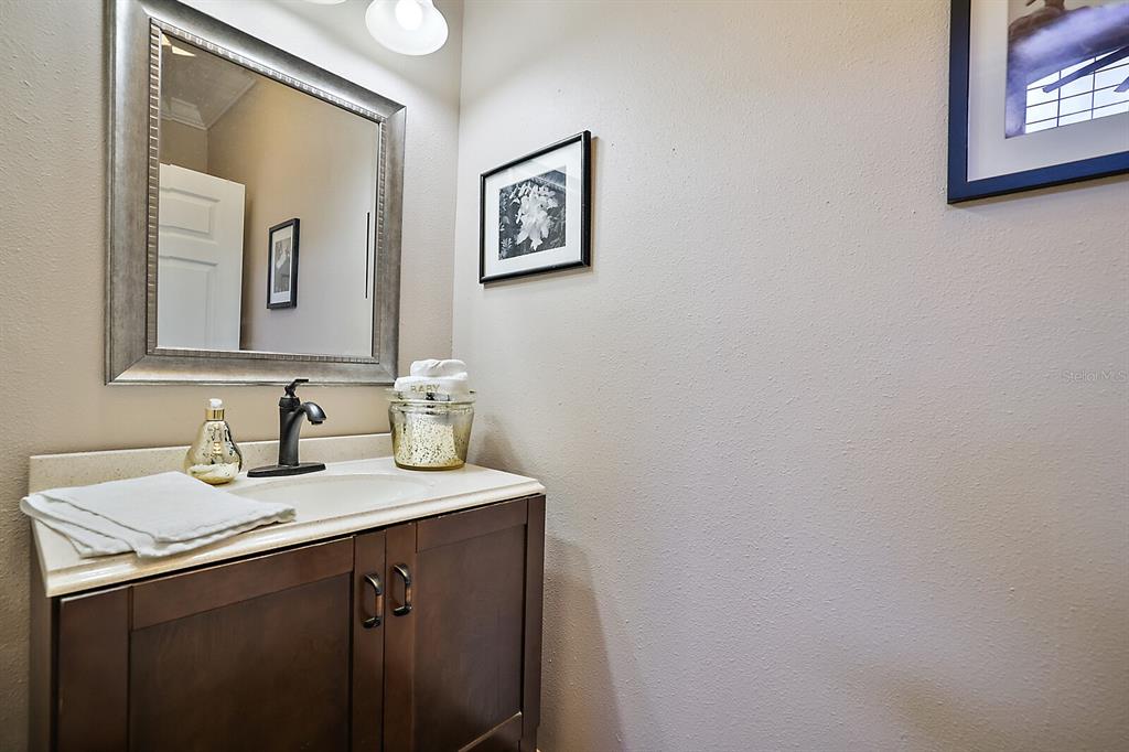 2701 Regal Point Place Eustis, FL 32726 - Photo 40 of 53 a bathroom with a sink vanity and mirror